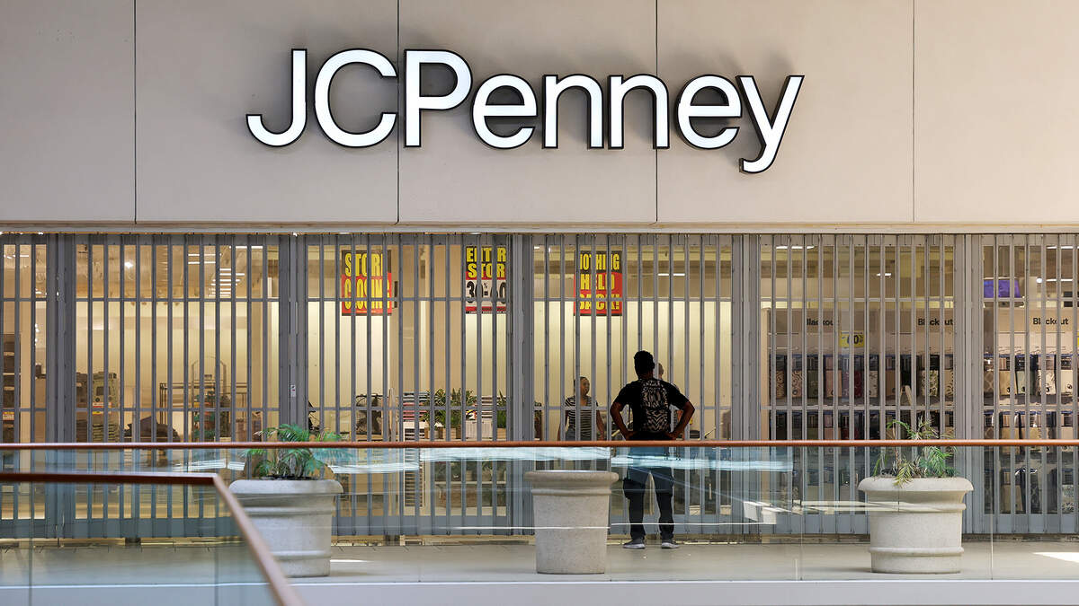 A shopper waits for JCPenney to open at the Ridgmar Mall on Thursday, Aug. 27, 2026. JCPenney is one of the few stores still open at the mall. It is set to close in November.